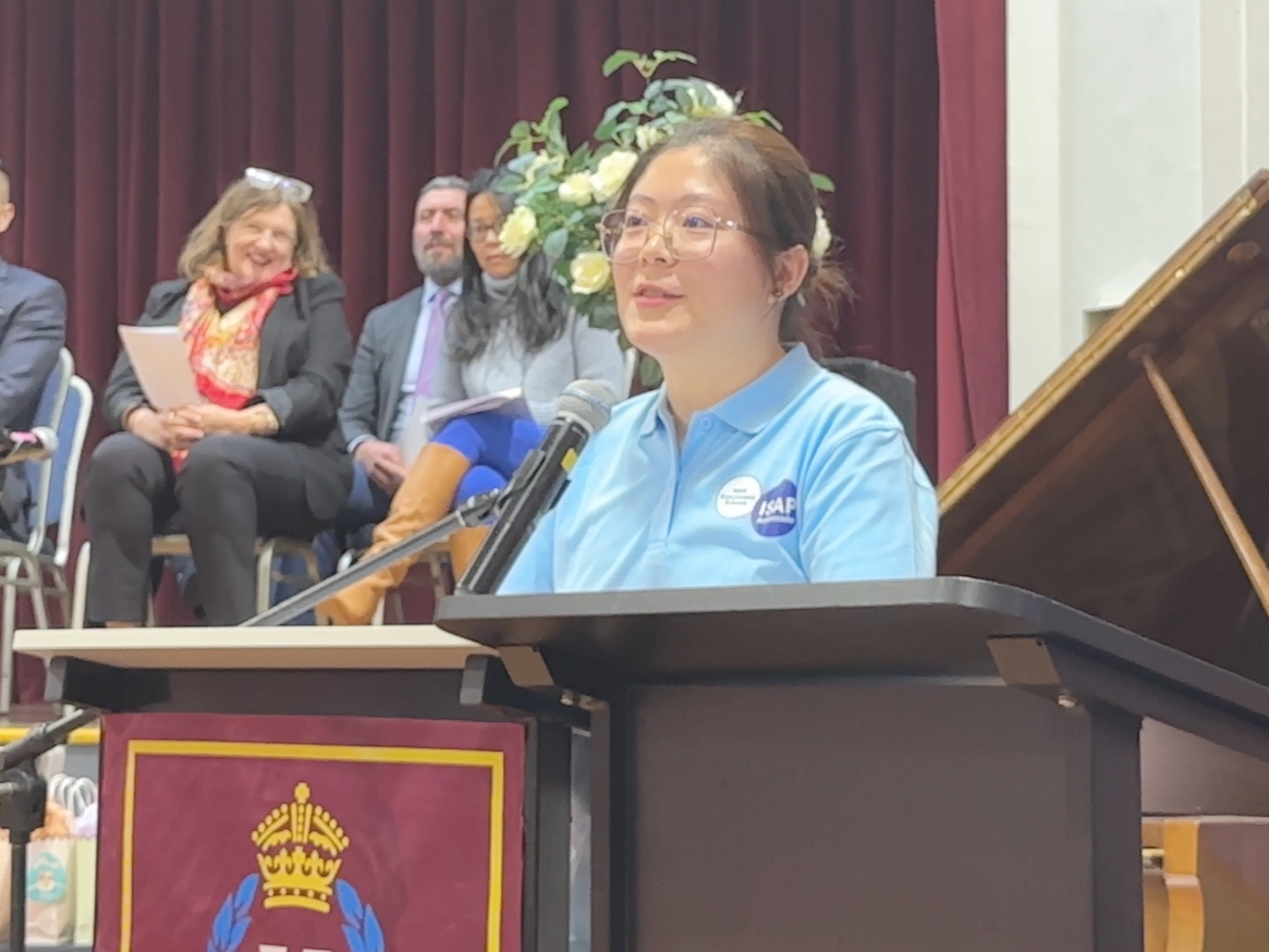 Female speaking behind a lectern