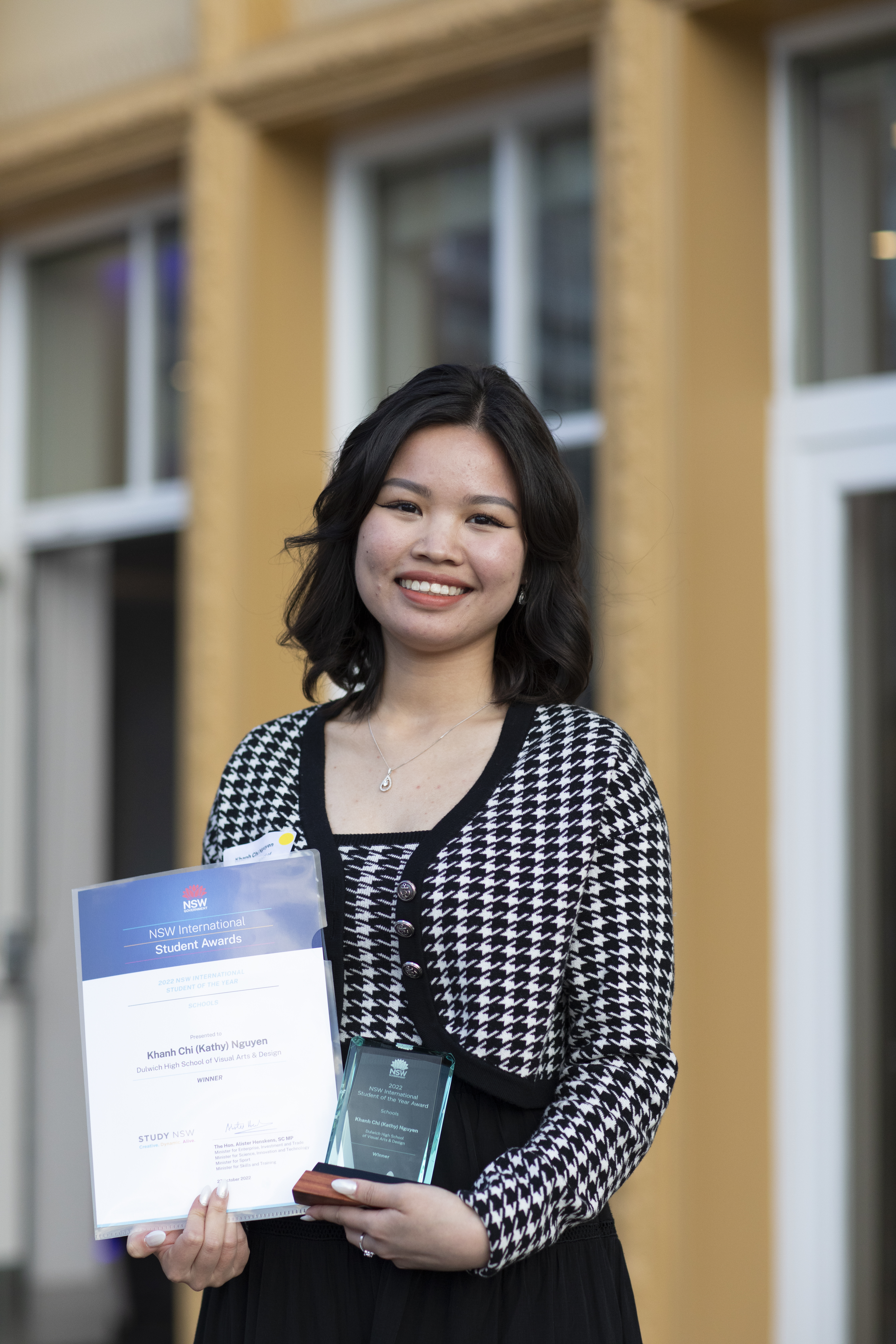 Female student holding trophy